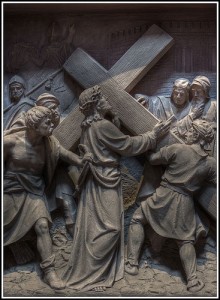 Jesus made to carry his cross